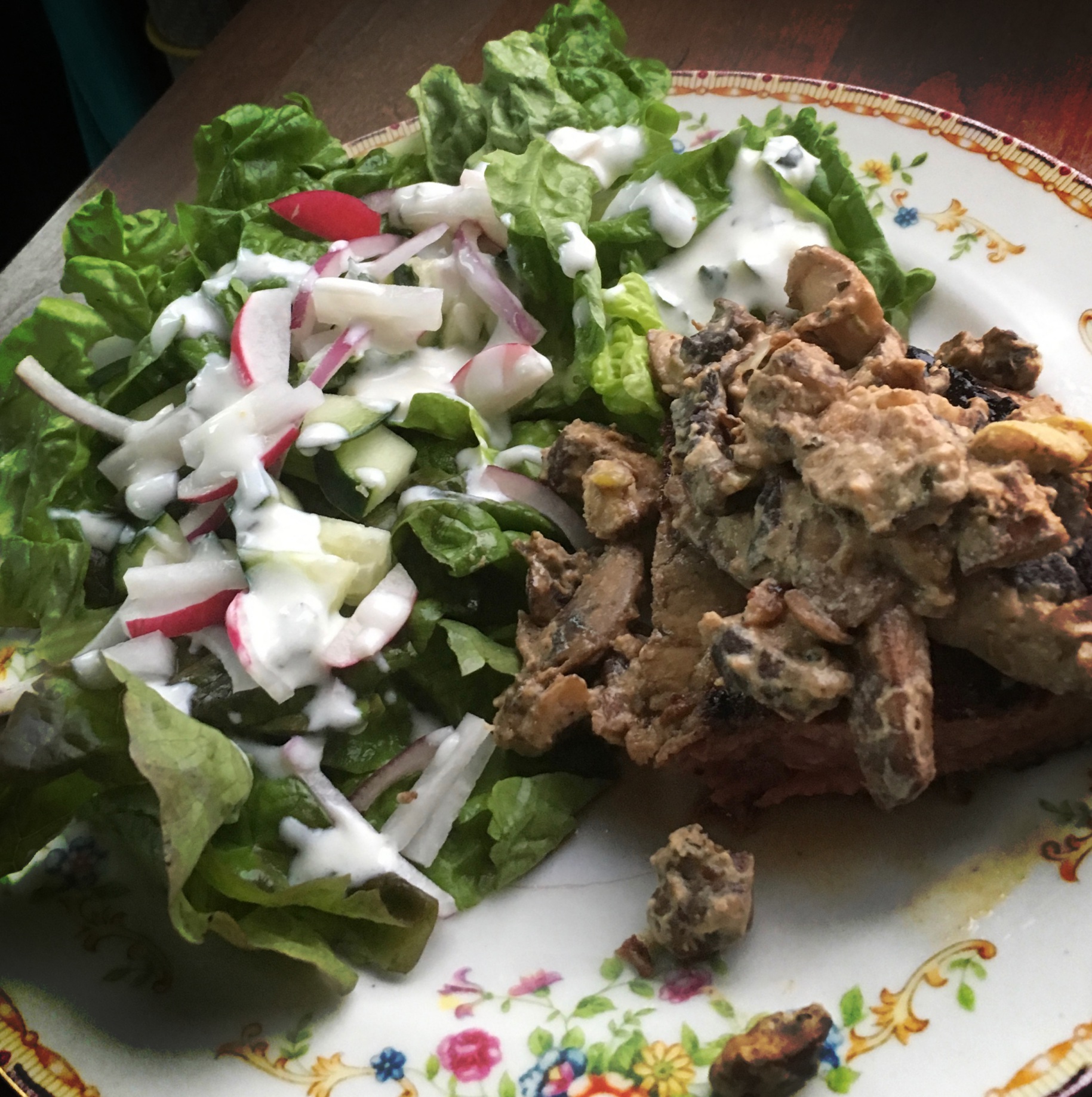 Salad with yogurt-based dressing, and steak topped with a yogurt-based mushroom sauce