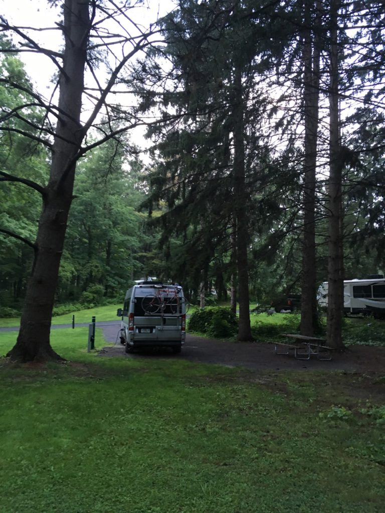 a camper van in a spacious campsite