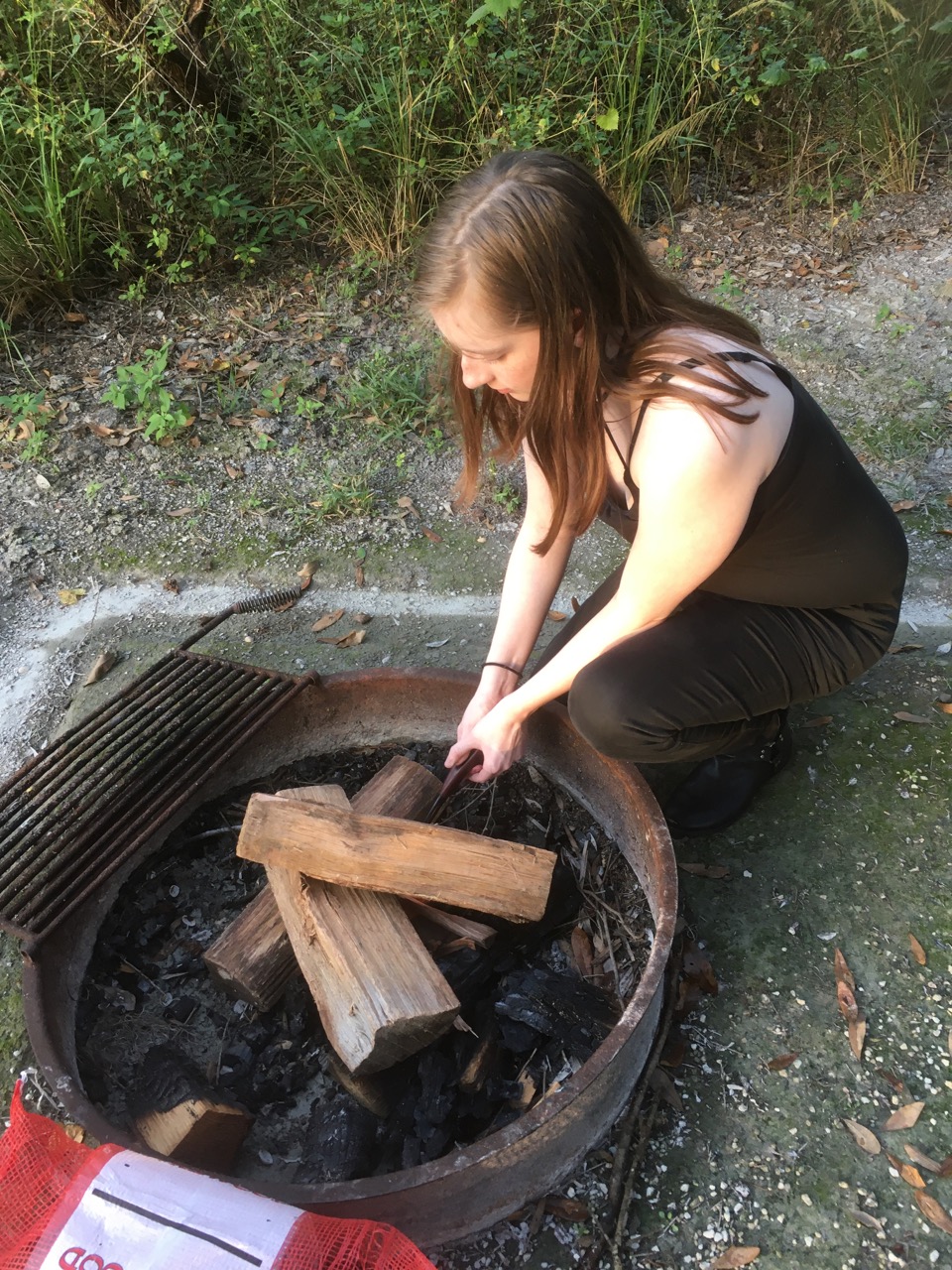 My niece lighting our campfire at Lake Louisa. 