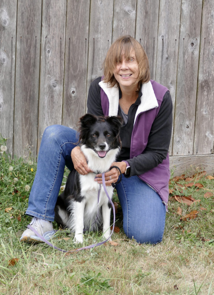 a picture of Sophie (my super cute dog) and me, outside, at our dog training field day